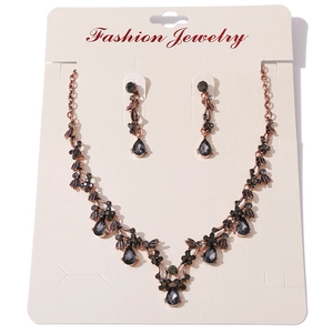 Vintage crystal rhinestone necklace and earring set with dark gray teardrop gems
