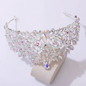 Macro detail of silver baroque bridal crown with vibrant AB rhinestones and crystal vine patterns