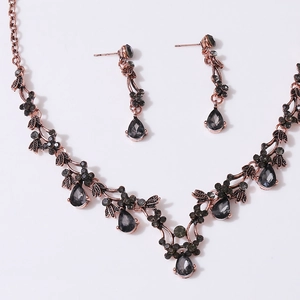 Vintage bronze bridal jewelry set with grey crystal droplets and rhinestone flower patterns