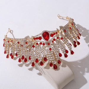 Detail of gold crystal tiara with red teardrop rhinestones and baroque fringe design