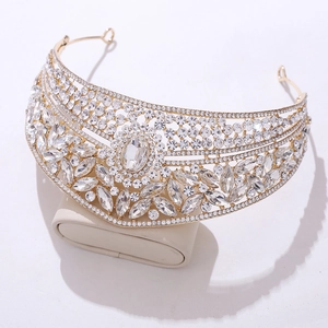 Close-up of gold bridal crown with marquise crystals and intricate rhinestone detailing
