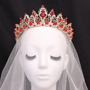 Golden Baroque bridal crown with red crystals and white diamonds on black background