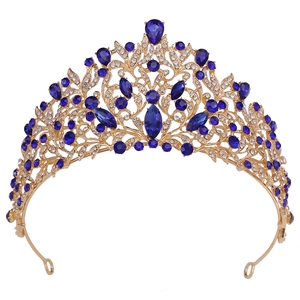 Macro detail of Baroque wedding crown with royal blue crystals and gold metalwork