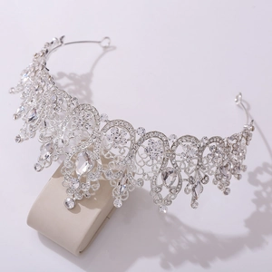 Detailed macro view of baroque silver bridal crown with crystal pear-shaped stones