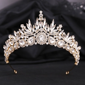 Detailed macro view of crystal leaf bridal crown on premium black velvet background