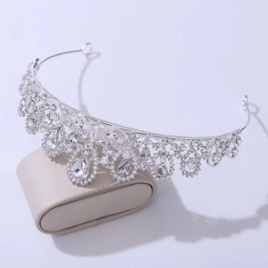 Close-up of sparkling silver bridal crown with teardrop rhinestones and baroque crystal detail