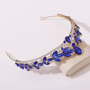 Luxurious bridal crown with deep blue crystals and silver rhinestones for weddings