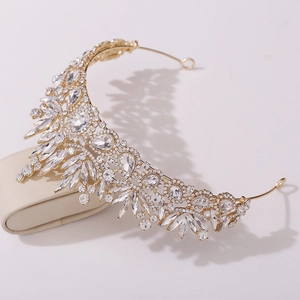 Macro detail of bridal crown featuring leaf motifs and intricate crystal diamond settings