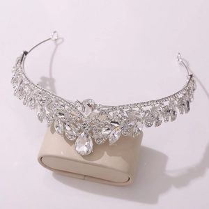 Luxurious bridal tiara crown with silver metal and sparkling teardrop crystal stones