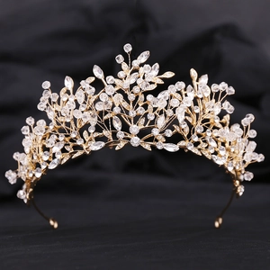 Detail of handmade gold leaf tiara with sparkling crystal beads for wedding hairstyles
