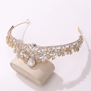 Detailed 45-degree angle of a luxury gold bridal crown with sparkling crystal rhinestones