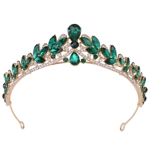 Luxurious gold bridal crown with vintage emerald green gems and sparkling white zircons