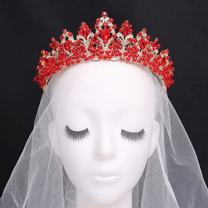 Baroque red crystal bridal crown with golden alloy base on a mannequin head model