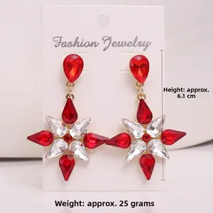 Detailed view of crystal star earrings measuring 6.1 cm in height and weighing 25 grams