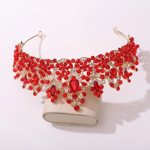 Detailed macro view of the sparkling red rhinestones and golden alloy on the crown