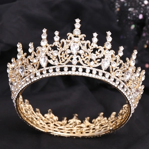 Detailed close-up of intricate crystal embedding on luxury gold bridal tiara with rhinestones