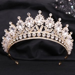 Detailed macro view of classical gold alloy bridal crown with white cubic zirconia crystals