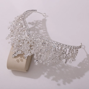 Macro shot of silver bridal crown featuring V-shaped crystals and shimmering tassels