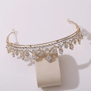 Macro detail of elegant golden bridal crown featuring white zircon and waterdrop stones