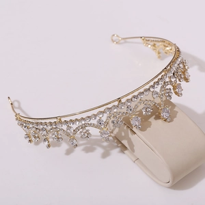 Detail of gold bridal tiara featuring zircon floral patterns and clear crystal stones