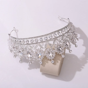 Macro view of silver bridal crown with glittering crystals and marquise pendants