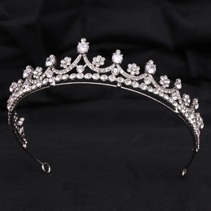 Elegant silver bridal tiara crown with sparkling cubic zirconia on black silk fabric