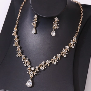 Golden bridal jewelry set with sparkling rhinestones and pear-shaped crystal pendants