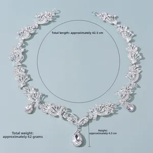 Detail view of silver bridal necklace with crystal vines and teardrop pendants