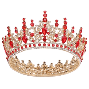 Detailed view of Baroque crown with red teardrop gemstones and white crystals