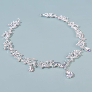 Detailed macro view of silver bridal tiara with sparkling rhinestones and drop pendants
