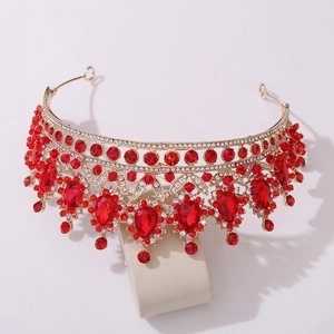 Detailed macro view of bridal crown featuring red teardrop crystals and gold framework