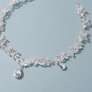 Elegant silver bridal headband with crystal flowers and pear-shaped water drop pendants