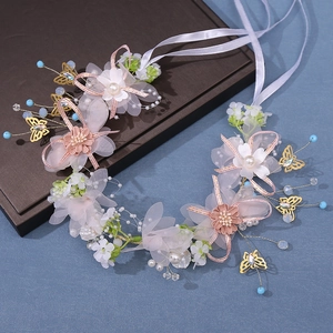 Handmade bridal floral crown with pink tulle flowers and golden butterfly accents