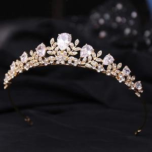 Side view of golden leaf bridal crown with AAA cubic zirconia and pear-shaped stones