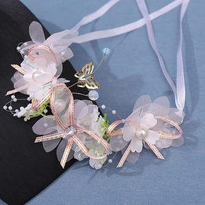 Handmade bridal hair wreath with pink mesh flowers, pearls, and golden butterfly crown
