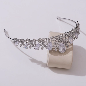 Detailed view of silver bridal crown featuring leaf motifs and pear-cut cubic zirconia