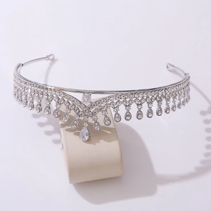 Close-up of a silver bridal tiara with AAA zircons and a teardrop crystal centerpiece