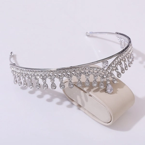 Detailed side view of silver bridal tiara with AAA zircons and drop pendants