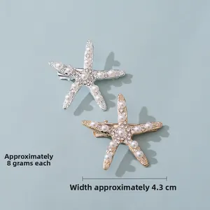 Detail of starfish hair clip with pearls and rhinestones on blue background