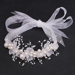 Elegant white floral bridal headband with faux pearls and organza ribbons for weddings