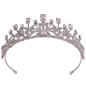 Detailed view of silver bridal crown with hollow leaf design and teardrop zircon