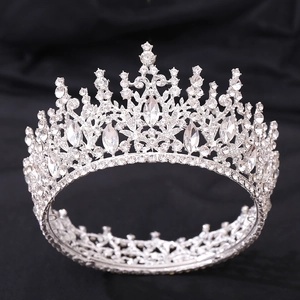 Close-up of silver bridal crown with intricate crystal and rhinestone floral details