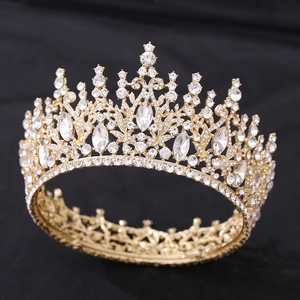 Close-up of a gold bridal crown with shimmering crystals and intricate rhinestones
