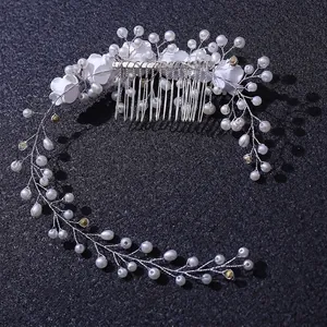 Handmade bridal hair comb with white fabric flowers and pearls on silver vine wiring
