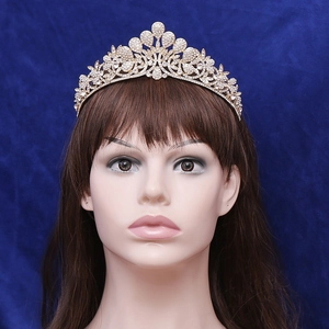 Elegant gold bridal crown with white rhinestones and floral motif for wedding hair accessories