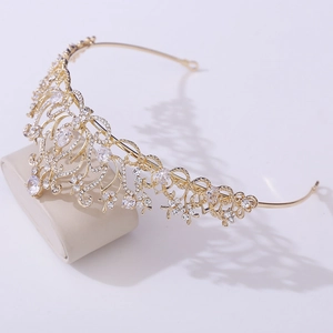 Detailed close-up of golden bridal crown featuring lotus pattern and AAA zircon stones