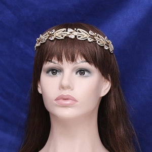 Exquisite gold bridal crown with leaf patterns and sparkling white zircon stones