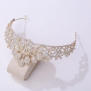 Detailed view of bridal crown with gold alloy base and sparkling white rhinestones
