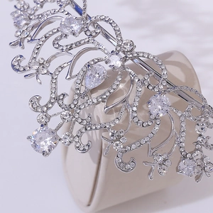 Silver lotus crown with AAA cubic zirconia in vintage filigree style on a display stand