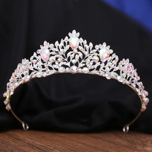 Macro detail of luxury bridal tiara featuring iridescent AB crystals and silver alloy